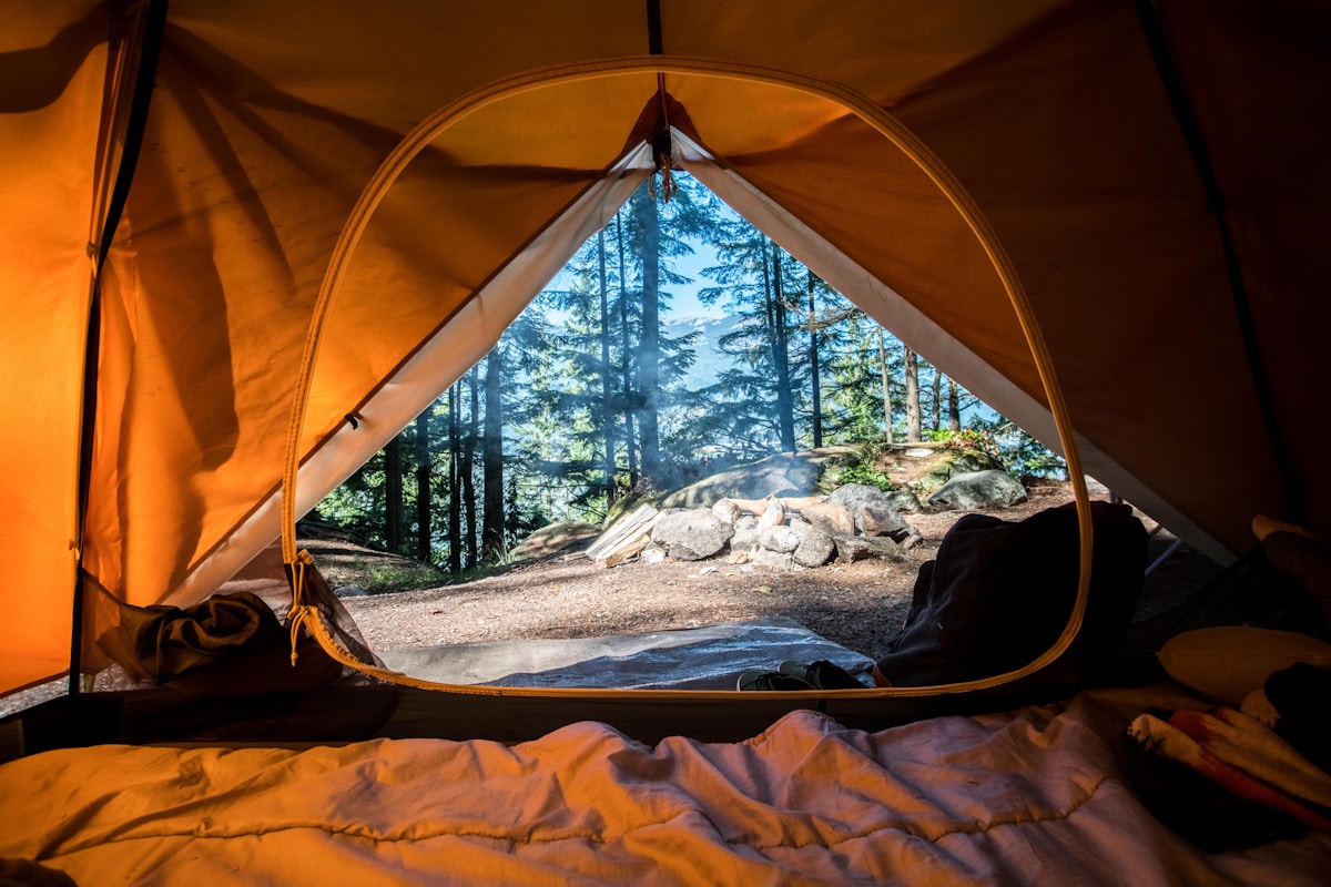 Guide helping client on outdoor trip